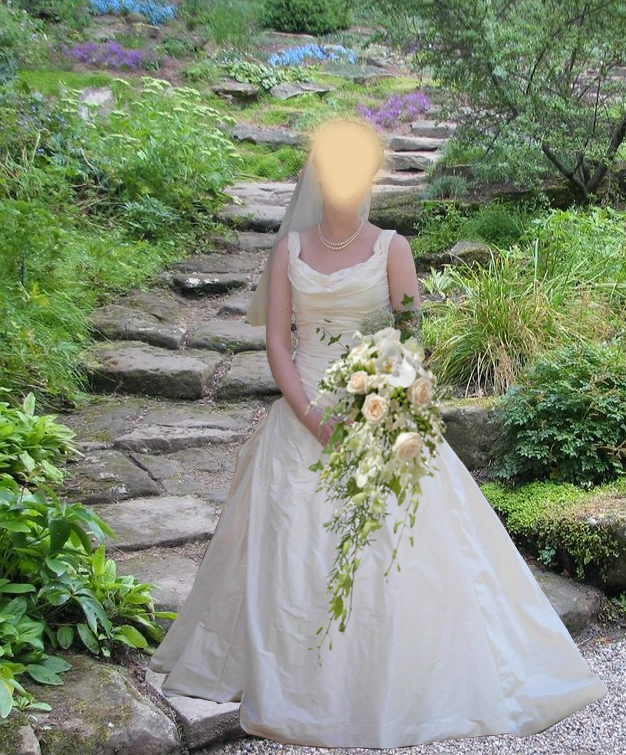 Sleeveless wedding gown with ruched bodice and full skirt in ivory dupion silk